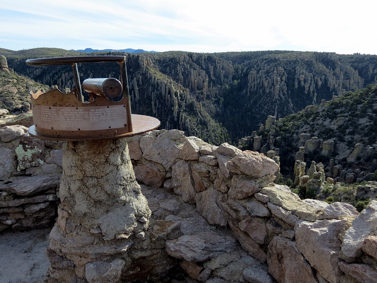 File photo of rock spires and hoodoos at Chiricahua National Monument in Arizona, with a set of telescopes for visitors in the foreground