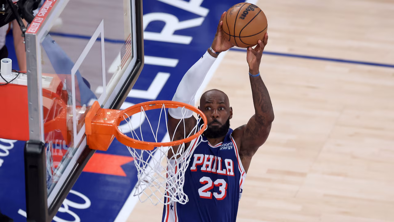 LeBron James of the Philadelphia 76ers dunks against the New York Knicks at Madison Square Garden on October 20, 2026.