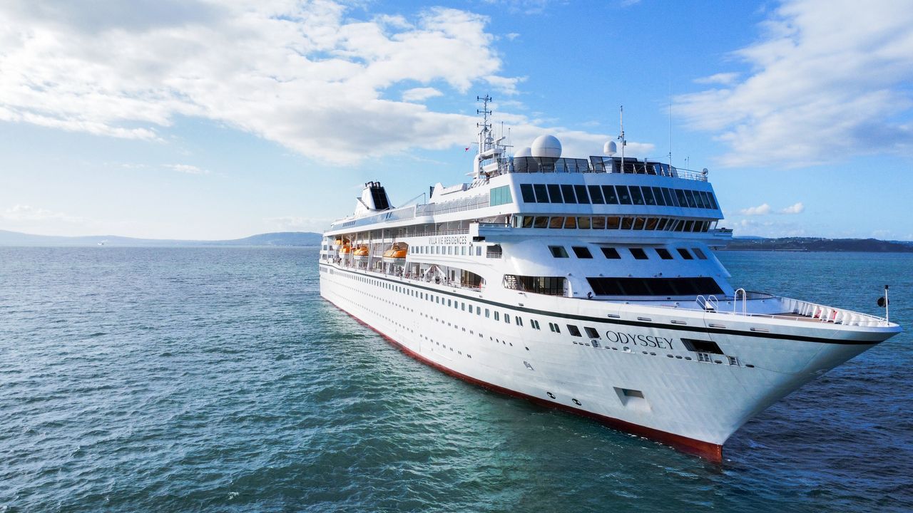 The Villa Vie Odyssey residential cruise ship sails on open water.