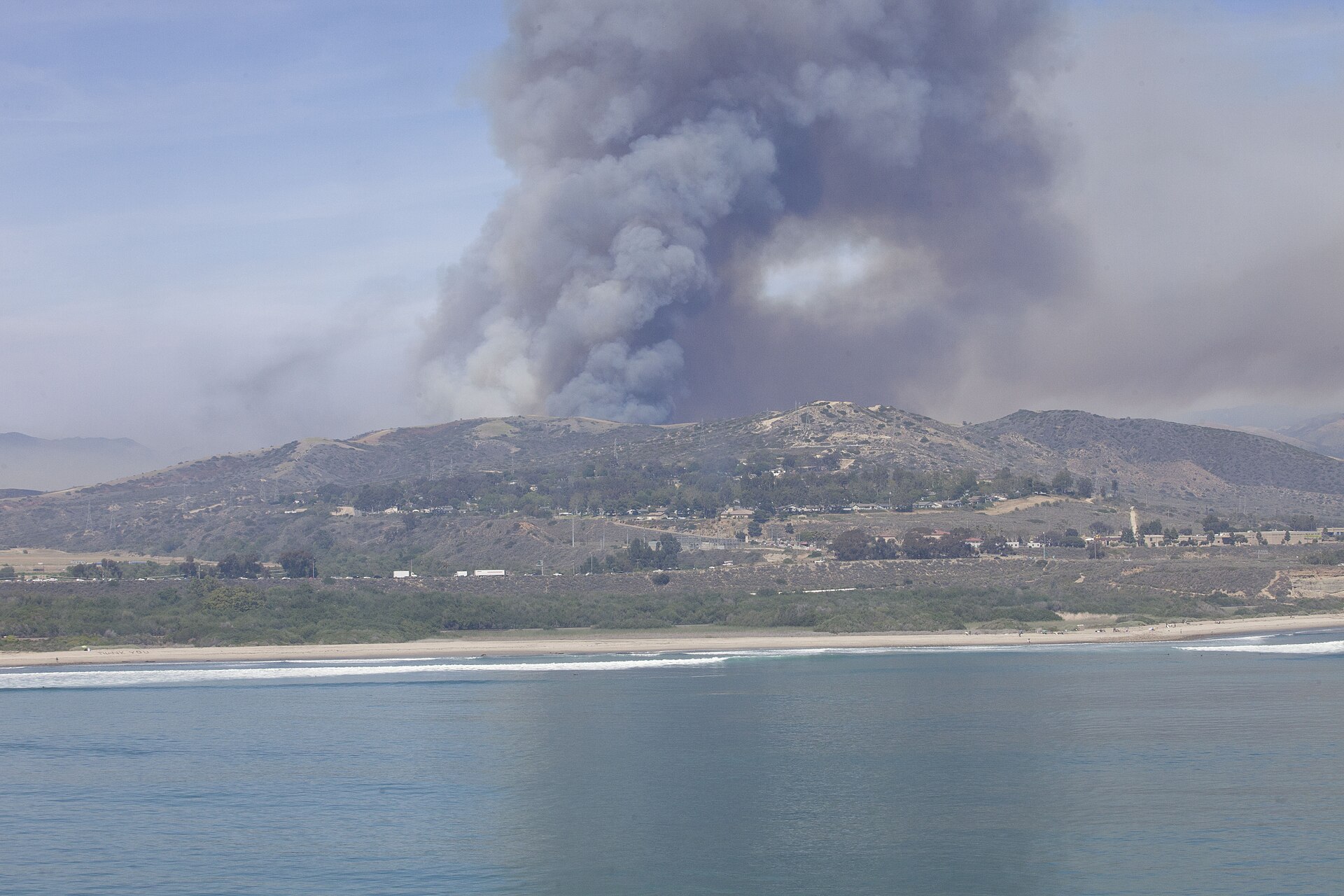 File photo from May 2014 of military and Cal Fire aircraft dropping water on the Las Pulgas wildfire at Camp Pendleton, California