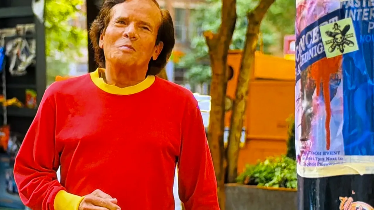 Michael Gray wearing a red and yellow shirt in his Shazam! Fury of the Gods cameo