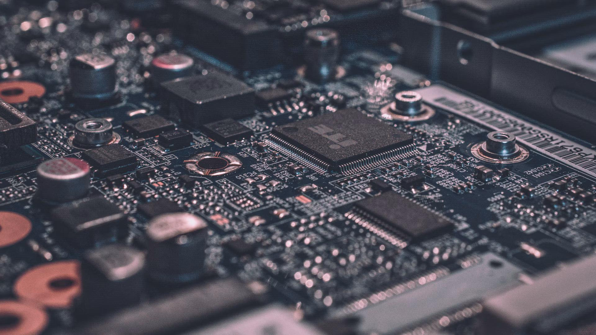 Close-up of electronic circuitry, illustrating the interconnected systems targeted by autonomous cybersecurity agents.