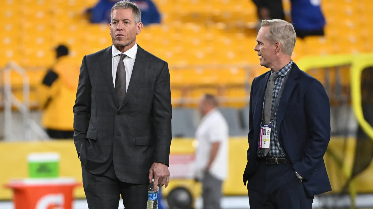 File photograph of Joe Buck and Troy Aikman together at an NFL stadium.