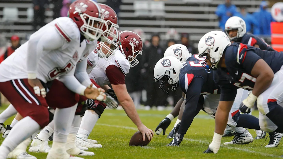 UMass and UConn players line up before a snap in a previous meeting