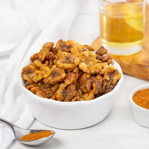 A prepared serving of spiced roasted walnuts