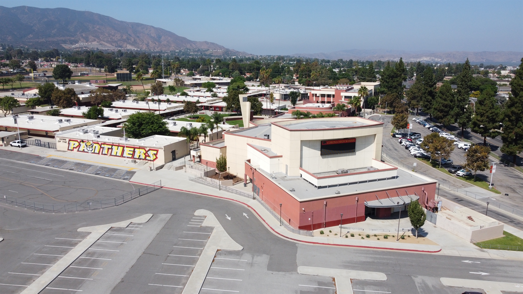 Archival aerial photograph of the Corona High School campus and surrounding streets in Corona, California.