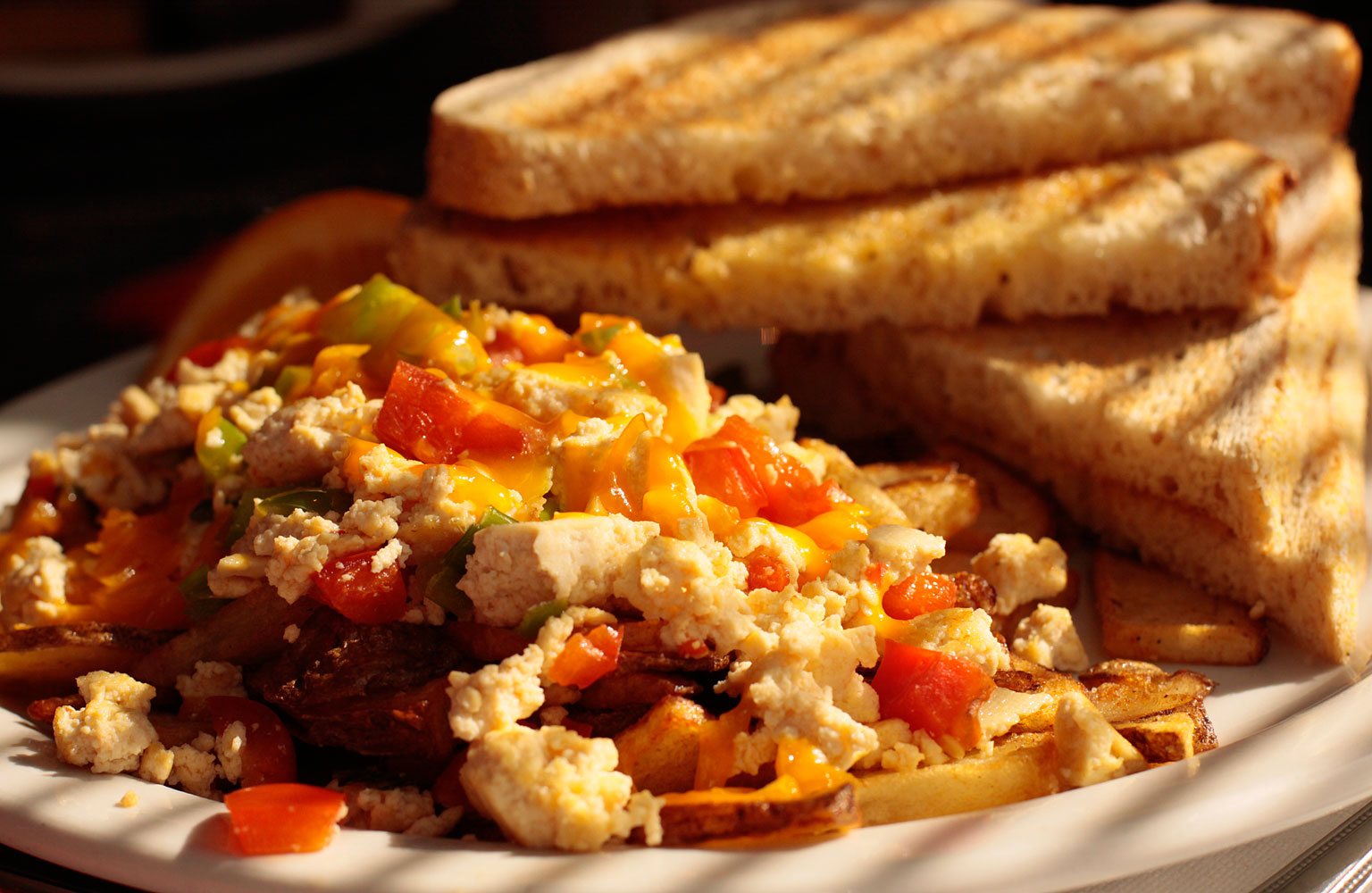 A prepared serving of tofu and vegetable breakfast scramble