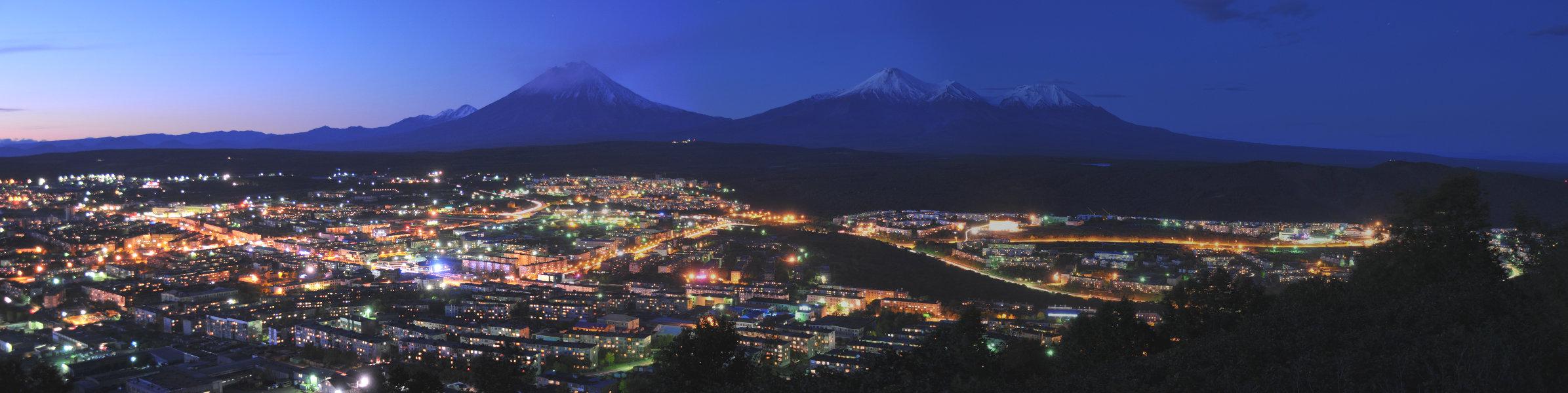 Night panorama of Petropavlovsk-Kamchatsky, the main city on Russia's Kamchatka Peninsula, with lights along the bay