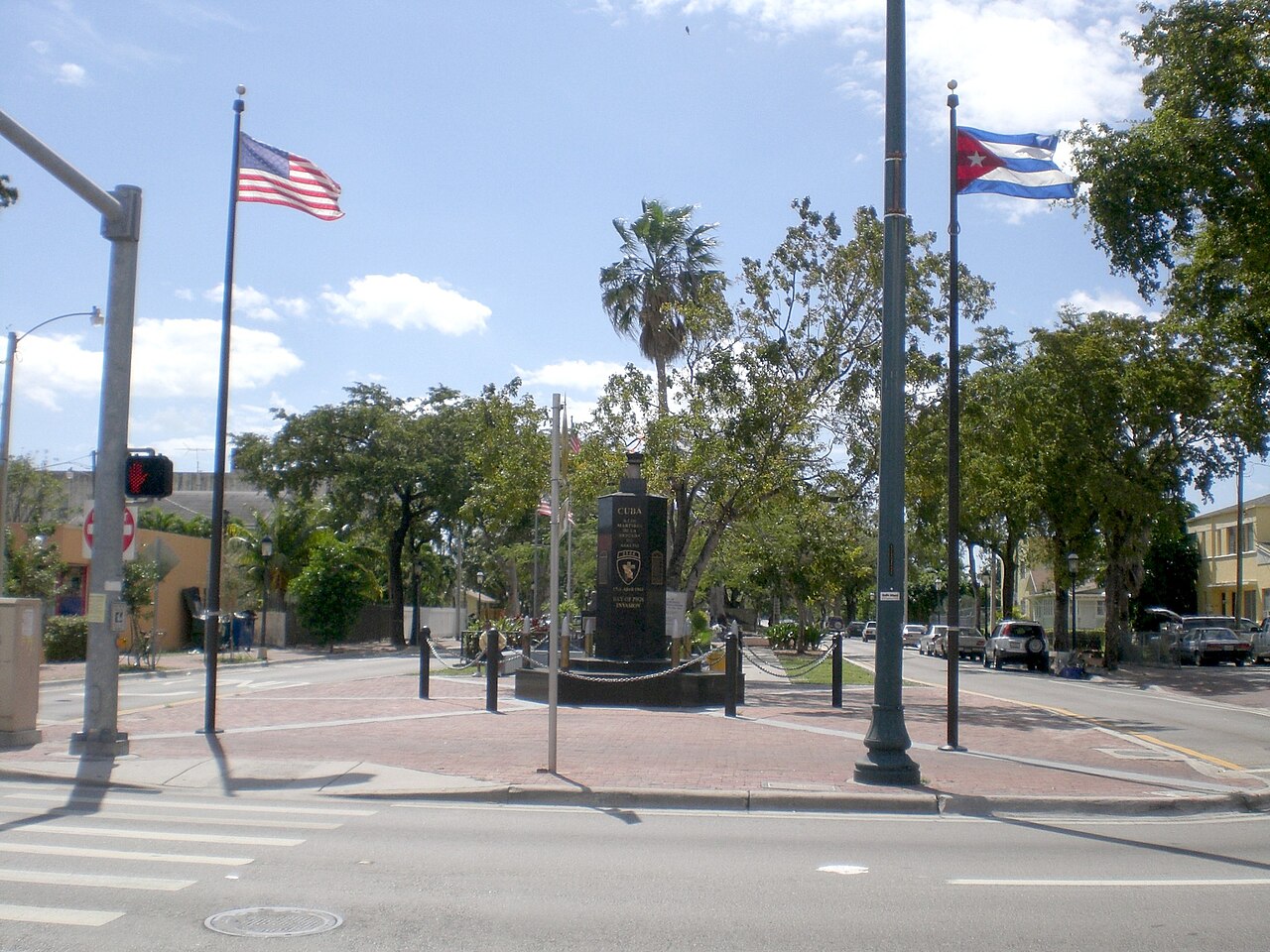 U.S. and Cuban flags fly beside the Cuban Memorial Plaza monument on Calle Ocho in Miami's Little Havana neighborhood.