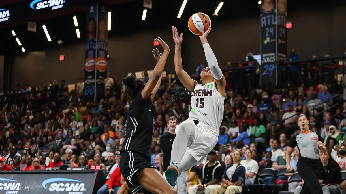 Atlanta Dream guard Allisha Gray drives toward the basket as Golden State Valkyries defender Tiffany Hayes contests the shot in a file photograph