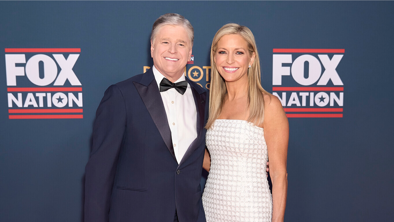 Fox News hosts Ainsley Earhardt and Sean Hannity posing together after announcing their engagement